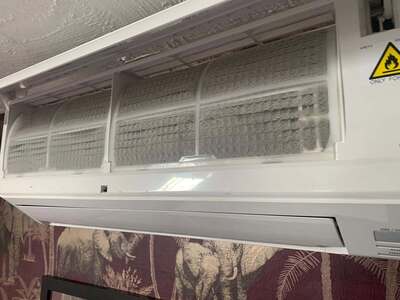 T.M. Airconditioning engineer completing an installation