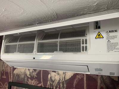 Split system air conditioning unit installed in bedroom